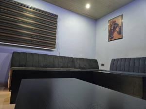 a conference room with a table and two chairs at We a in Port Harcourt
