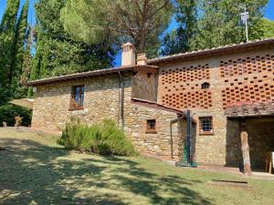 a brick building with a chimney on top of it at Berenice in Chianti - Authentic Tuscan Country House in Bagno a Ripoli