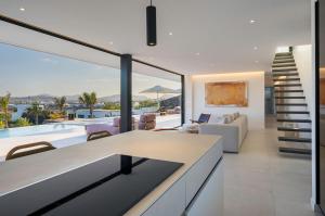 a living room with a view of the ocean at Villa White Lava by Aura Collection in Lajares