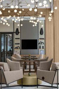a conference room with a table and chairs at AC Hotel by Marriott Clearwater Beach in Clearwater Beach