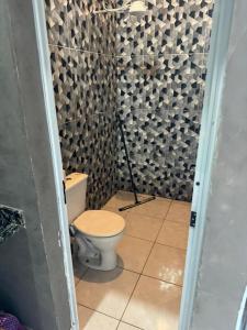 a bathroom with a toilet in a room at Espaço Nosleda in Santana de Parnaíba +21 photos