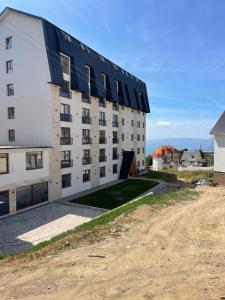 a building with solar panels on the side of it at Evergreen Lux in Kopaonik