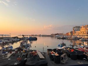 a group of boats are docked in a harbor at Tower casa vacanze 1 in Anzio