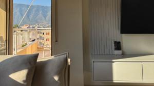 a table and chairs with a view of a balcony at Orikum Getaway in Orikum +8 photos