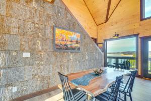 a dining room with a wooden table and chairs at Lakeside Bear Lodge in Sevierville