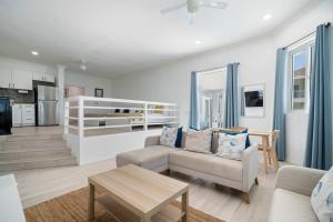 a living room with a couch and a table at House Jorja in Nassau +13 photos