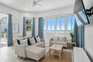 a living room with a couch and a table at House Jorja in Nassau