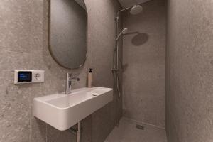 a bathroom with a sink and a mirror at Affordable Private Room Near University Tilburg in Tilburg