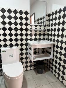 Ένα μπάνιο στο Sunset Bungalows & GH