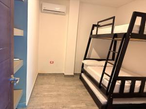 a room with two bunk beds and a door at Finca La Casa de Pablo in Doradal +40 photos