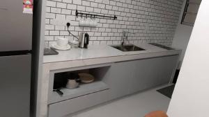 a kitchen with a sink and a counter top at A3-6-1Silverpark LuxMountsin view Lifted unit in Bukit Fraser +33 photos