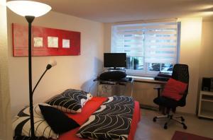 TV a/nebo společenská místnost v ubytování Studio-Appartment Horgen + 2 fotografie