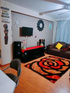 a living room with a couch and a rug at Peaceful stay in Richards Bay