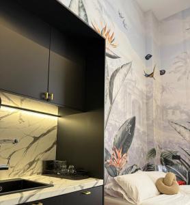 a bedroom with a wall with a mural at Casa Debod in Madrid +48 photos