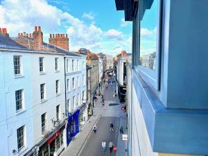 a view from a window of a city street with buildings at York City Centre 2 Bed Flat with Views - Steps from Christmas Market in York