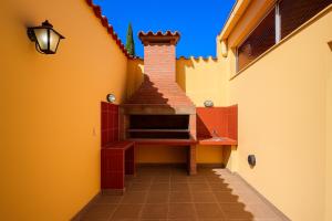 a hallway of a house with a table on a wall at Hotel Patios de Salta in Salta