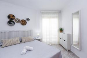 Кровать или кровати в номере FUENTE Apartment