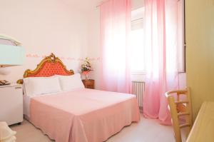 Postel nebo postele na pokoji v ubytování Hotel Giongo