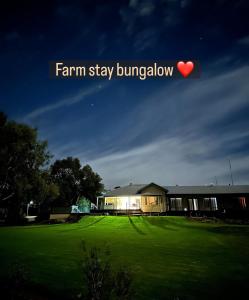 a building with a yard with a heart in the sky at Sandalwood Downs Fabulous Farm Stay TOODYAY in Toodyay