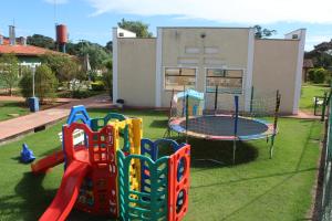 a group of playground equipment in a yard at Hotel Fazenda 7 Belo in Socorro