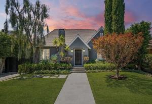 a house with a yard with grass and trees at Villa with Heated Pool & SPA in Los Angeles