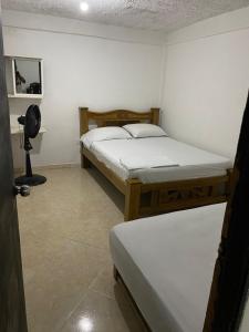 Ένα ή περισσότερα κρεβάτια σε δωμάτιο στο Apartamento Goyo en Coveñas