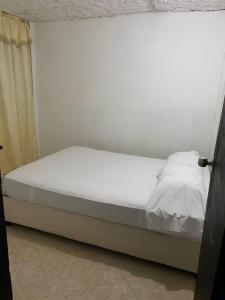 Ένα ή περισσότερα κρεβάτια σε δωμάτιο στο Apartamento Goyo en Coveñas