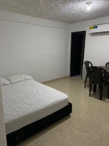 Ένα ή περισσότερα κρεβάτια σε δωμάτιο στο Apartamento Goyo en Coveñas