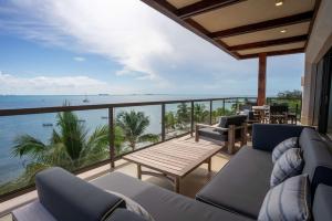a balcony with a view of the ocean at Luxury Beachfront 4BR Apartment in Isla Mujeres in Isla Mujeres
