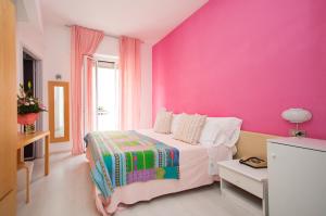 Postel nebo postele na pokoji v ubytování Hotel Giongo