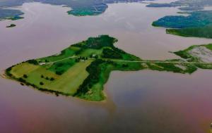 an island in the middle of a large body of water at Luxury oceanfront escape in Neguac