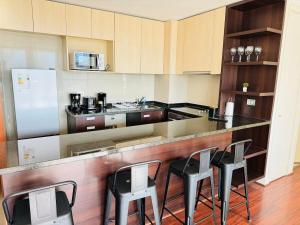 Η κουζίνα ή μικρή κουζίνα στο Parque Arauco - Clínica Alemana +4 φωτογραφίες