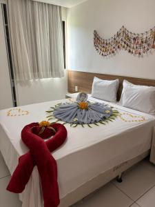 Ένα ή περισσότερα κρεβάτια σε δωμάτιο στο Apartamento no Iloa Residence +6 φωτογραφίες