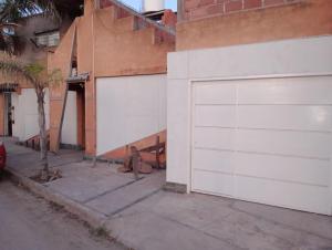 a white garage door on the side of a building at Loft in La Rioja