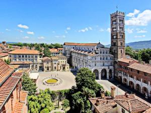 an aerial view of a city with a clock tower at Charming Mansion in Lucca in Lucca