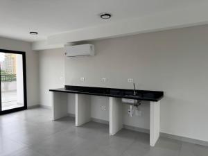 a kitchen with a sink in a room at Max Jardim São Paulo in São Paulo +184 photos
