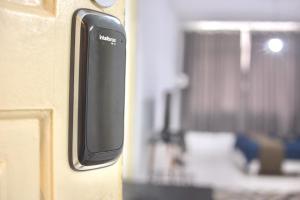 a close up of a door handle on a room at Stúdio no Centro- Lapa, Consulado, Praia e Metrô! 1101 in Rio de Janeiro