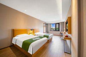 Postel nebo postele na pokoji v ubytování GreenTree Inn Shangrao Wuyishan Avenue Meide Yinxiang + 193 fotografií