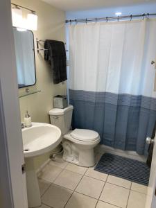a bathroom with a white toilet and a sink at Private Suite in Vancouver in Vancouver +10 photos