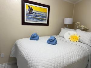 Ένα ή περισσότερα κρεβάτια σε δωμάτιο στο Great Gulf Views of Galveston +39 φωτογραφίες