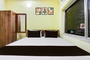 Ένα ή περισσότερα κρεβάτια σε δωμάτιο στο Hotel O Ruposhi bangla guest house