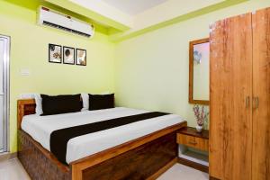 Ένα ή περισσότερα κρεβάτια σε δωμάτιο στο Hotel O Ruposhi bangla guest house