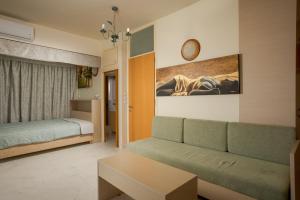 En eller flere senge i et værelse på Panoramic Sea View