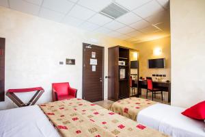 Rúm í herbergi á Piccolo Hotel Nogara