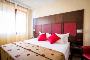 Postel nebo postele na pokoji v ubytování Piccolo Hotel Nogara + 37 fotografií