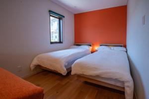 Giường trong phòng chung tại Kanawa Apartment - Vacation STAY 49655v