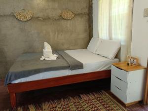 En eller flere senge i et værelse på Ocean View Villa