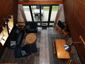 an overhead view of a living room with a table and chairs at Ferienhaus mit Terrasse, Haustierfrei in Clausthal-Zellerfeld