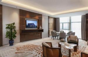 TV a/nebo společenská místnost v ubytování Nanjing Lakehome Hotels and Resorts