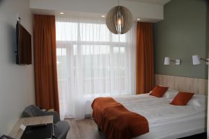 Postel nebo postele na pokoji v ubytování Hotel Hallormsstadur